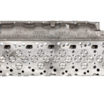 "Close-up image of high-quality head gaskets and cylinder heads, showcasing premium performance engine products designed for turbo upgrades and diesel engine rebuild kits, including Powerstroke parts."
