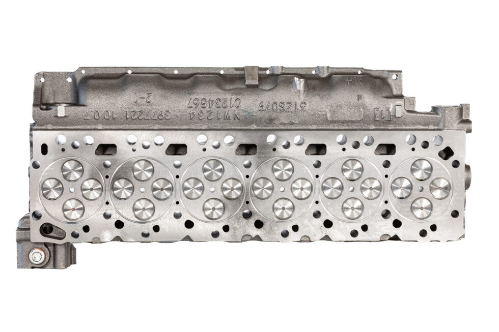 "Close-up image of high-quality head gaskets and cylinder heads, showcasing premium performance engine products designed for turbo upgrades and diesel engine rebuild kits, including Powerstroke parts."