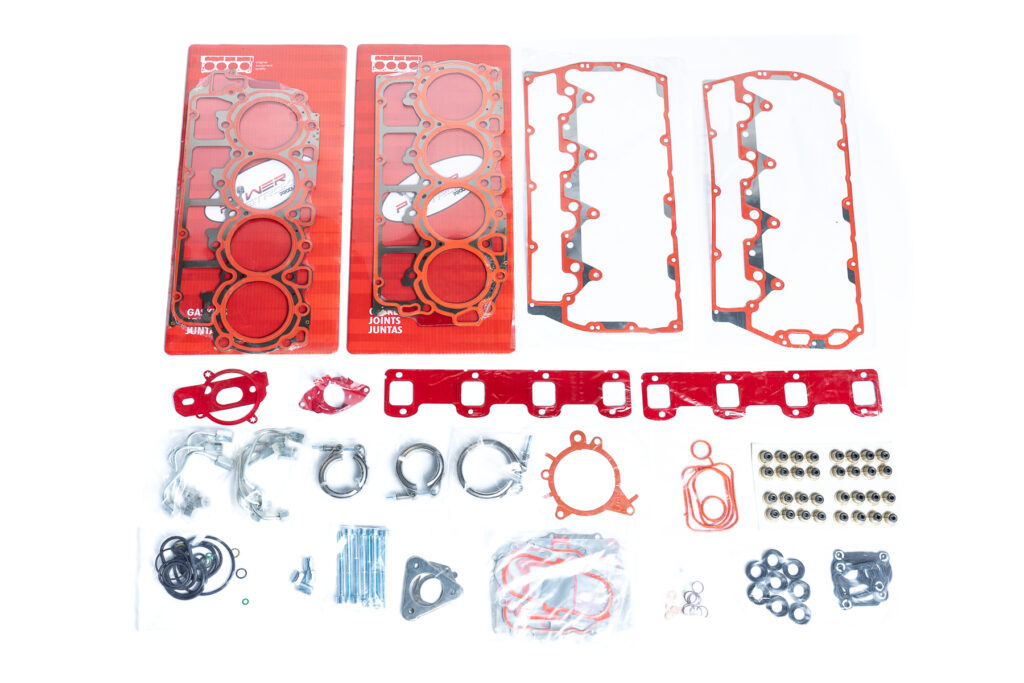 "Close-up image of high-quality head gaskets and cylinder heads, showcasing performance engine products ideal for turbo upgrades and diesel engine rebuild kits, including Powerstroke parts for enhanced engine efficiency."