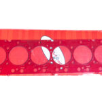 "Close-up image of high-performance head gaskets and cylinder heads, showcasing premium performance engine products for turbo upgrades and diesel engine rebuild kits, including top-quality Powerstroke parts."