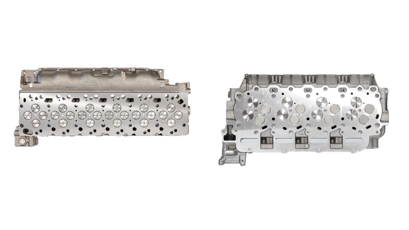 6.7 Cummins cylinder head beside a 6.7 Powerstroke cylinder head