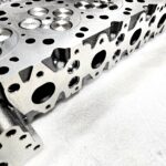"Close-up view of high-quality head gaskets and cylinder heads for performance engine products, including turbo upgrades and diesel engine rebuild kits, specifically designed for Powerstroke parts."